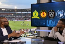 Cinq prétendants à suivre dans les barrages africains Deux analystes discutent de football dans un stade moderne